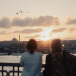 A couple of people that are looking at the water