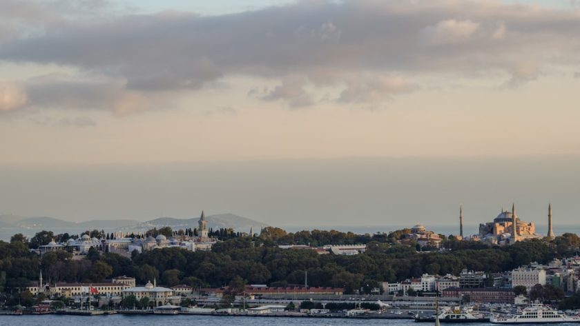 City skyline with historic buildings and a cloudy sky