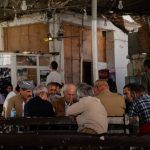a group of people sitting at a table