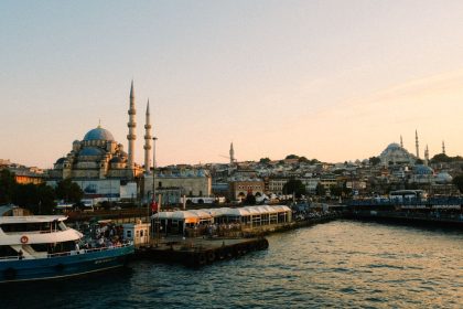 Stunning view of Istanbul with mosques and bustling harbor at sunset.