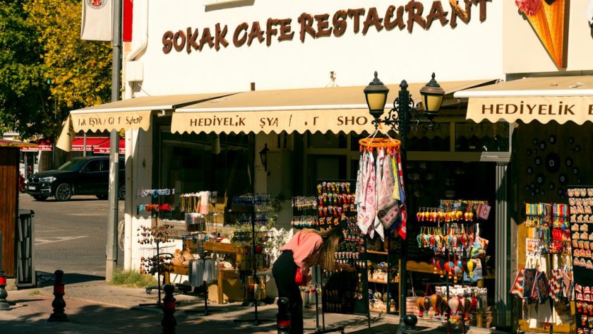 A woman shops outside a sokak cafe restaurant